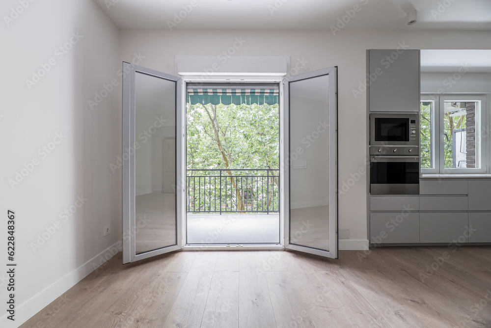 Wide twin folding doors of glass Wide twin folding doors of glass