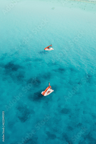 Aerial view of two pedalboats in San Vito Lo Capo sea, Sicily, Italy. photo