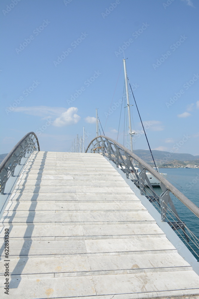 Semicircular bridge on the sea on a sunny day