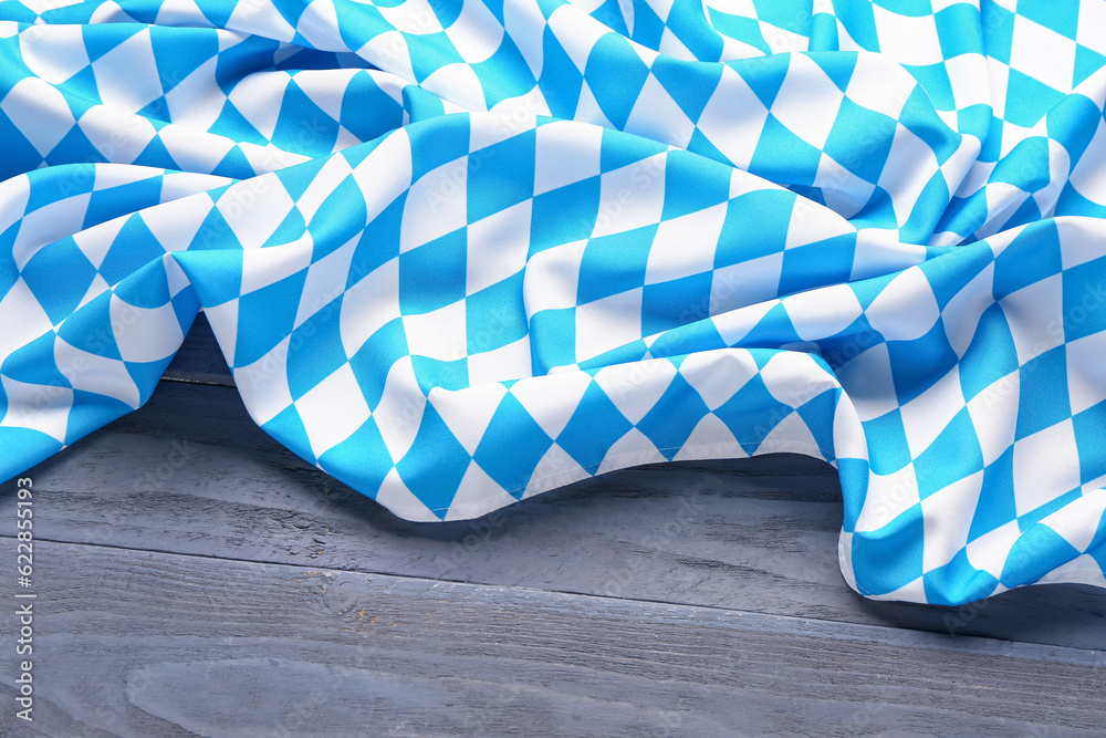 Obraz premium Flag of Bavaria on blue wooden background