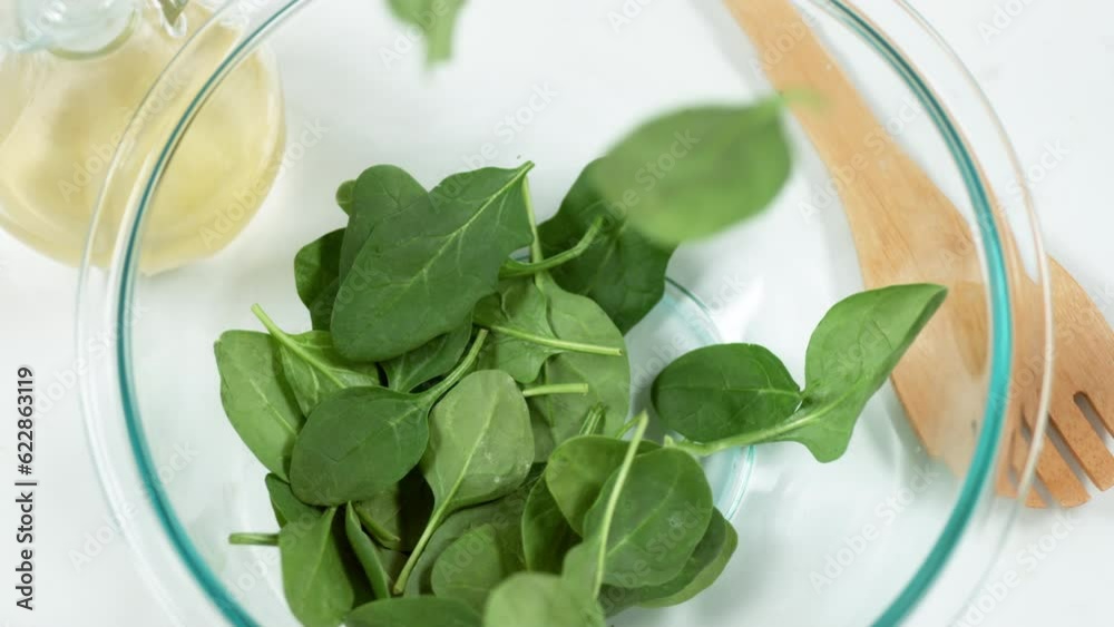 spinach salad on plate slow motion spinach salad on plate slow motion