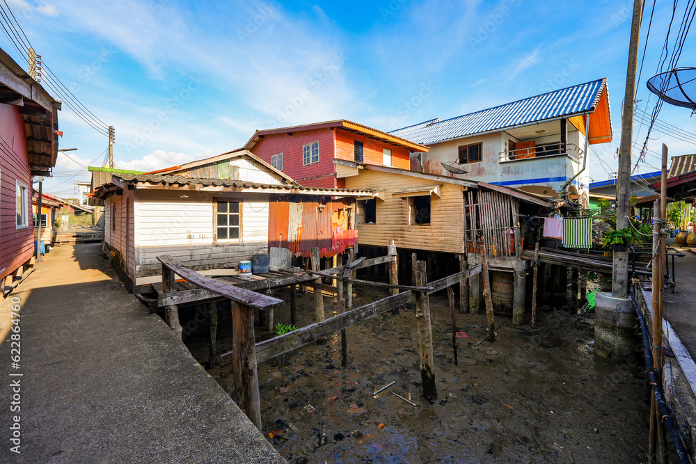 Houses on stilts in the floating fishing village of Koh Panyee, suspended over the waters of the Andaman Sea in the Phang Nga Bay, Thailand Houses on stilts in the floating fishing village of Koh Panyee, suspended over the waters of the Andaman Sea in the Phang Nga Bay, Thailand