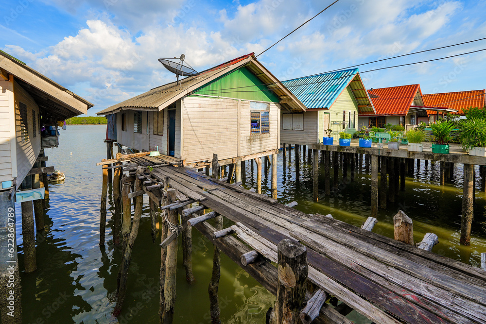 Houses on stilts in the floating fishing village of Koh Panyee, suspended over the waters of the Andaman Sea in the Phang Nga Bay, Thailand