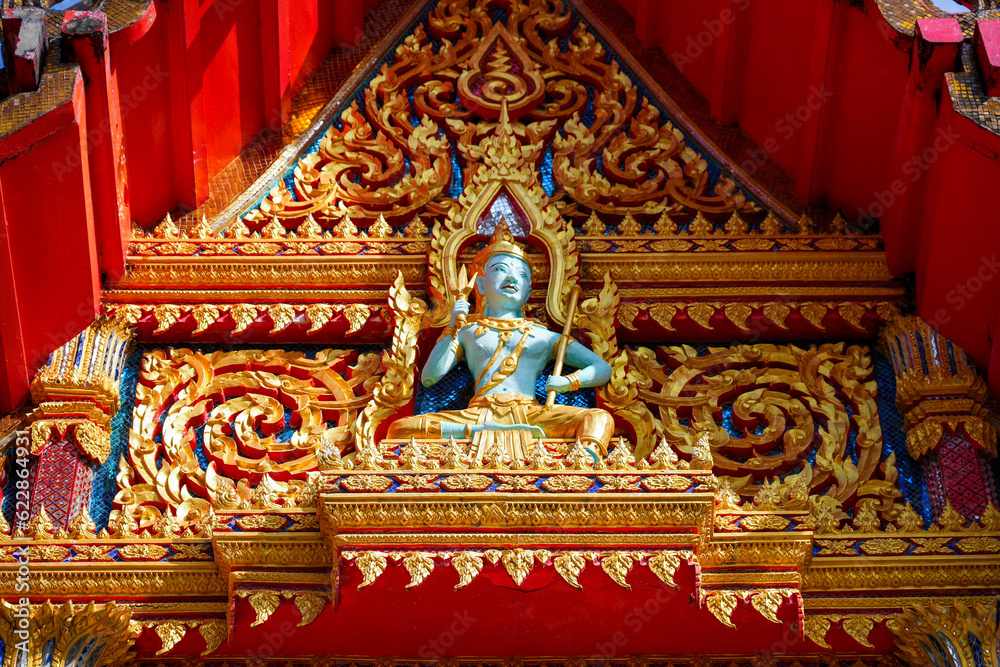 Buddha bas-relief in the Wat Chalong, a 19th century Buddhist temple on Phuket island in Thailand, Southeast Asia