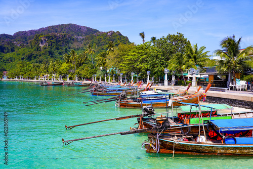 Longtail boats moored on the Ton Sai beach promenade on Koh Phi Phi island in the Andaman Sea, Krabi Province, Thailand