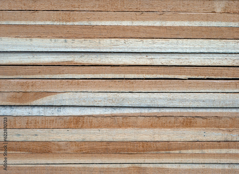 Box-shaped pile of teak wood for construction. Wooden texture background Box-shaped pile of teak wood for construction. Wooden texture background