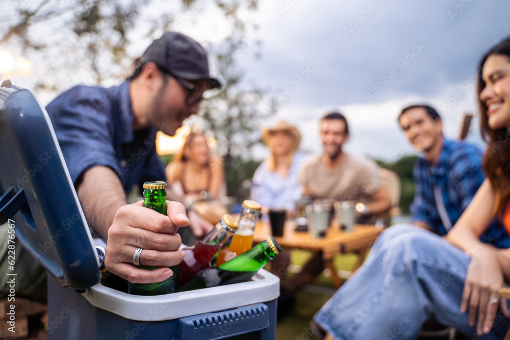 Group of diverse friend having outdoors camping party together in tent. Group of diverse friend having outdoors camping party together in tent.