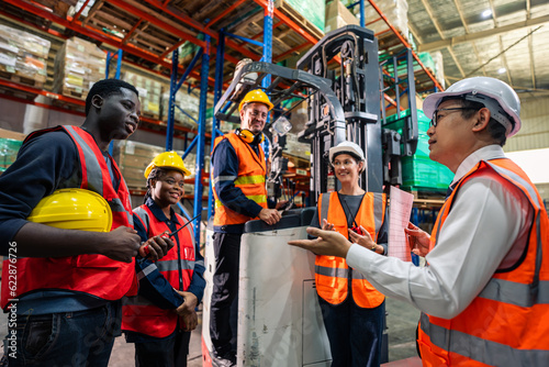 Group of man and woman industrial worker work in manufacturing plant. 