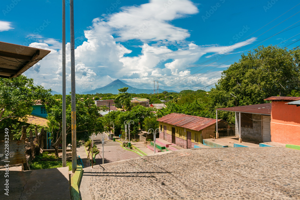 View of the Momotombo volcano, from Nagarote. Streets of Nagarote with a view of the momotombo volcano on a beautiful day