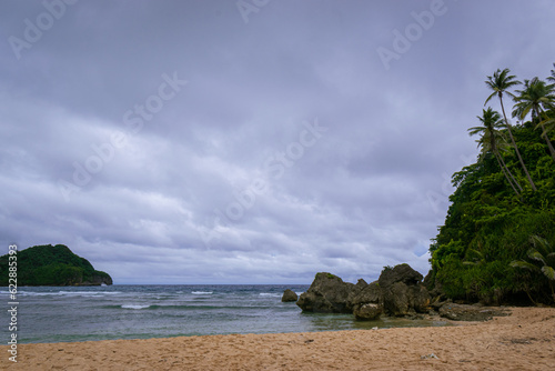 White sand beach on a cloudy day. Ferrol, Romblon, Philippines