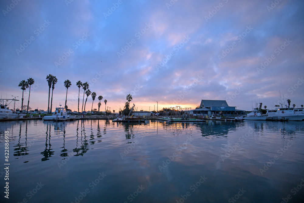 Sunrise pink sky over Channel Islands harbor in Port Hueneme on the gold coast of California United States