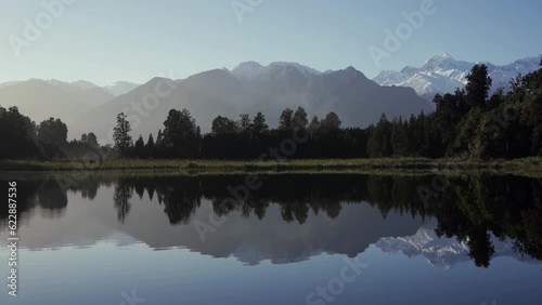 Reflection of the mountains in Lake Matheson. New Zealand, West Coast. photo