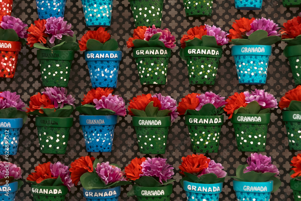 Background of Pots with flowers on a wall. Granada, Spain.