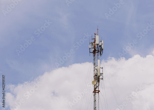 Cellular network towers or internet communications background as blue sky.