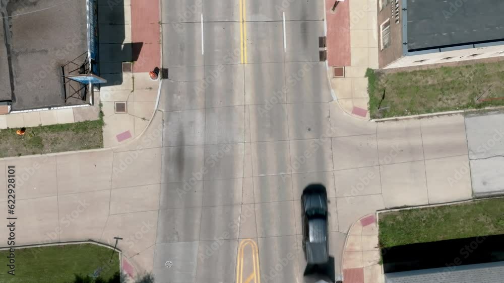 Intersection in downtown Moline, Illinois with drone video overhead looking down and stable. Intersection in downtown Moline, Illinois with drone video overhead looking down and stable.