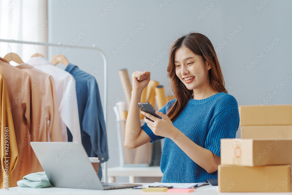 How To Start A Clothing Store Online Business apparel! Young confident asian female fashion owner social media influencer Live selling clothes, new products at home office small business e-commerce.