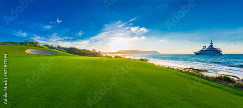 Beautiful golf course at the oceanside yacht on the sea at sunset, sunrise time.