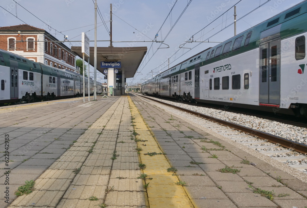 Fotka „Treviglio railway station arriving train Trenord Italia. Trenord