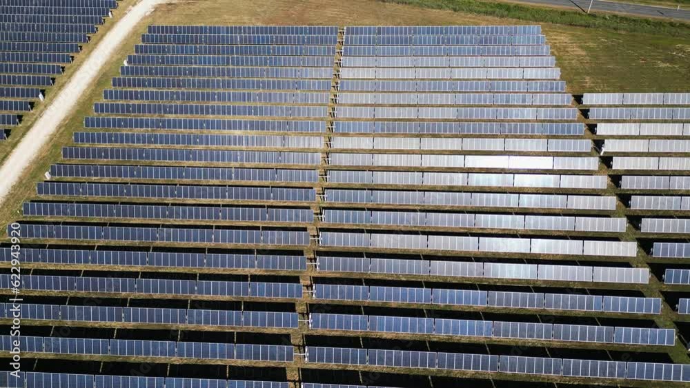 Aerial view tilting over a solar field, in sunny Salvaterra de Magos, Portugal Aerial view tilting over a solar field, in sunny Salvaterra de Magos, Portugal