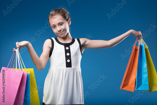 Girl joyfully mimics high-society shopping spree photo