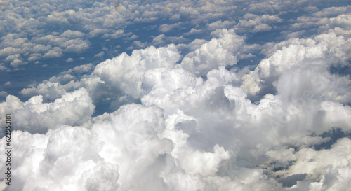aerial view of several clouds in a blue sky

