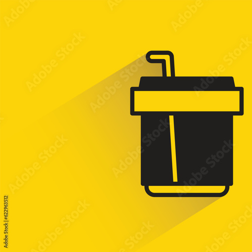 coffee cup with shadow on yellow background