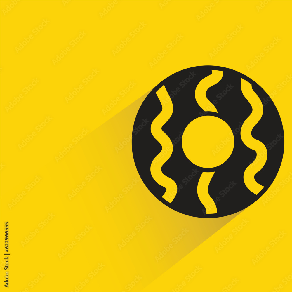 Obraz premium donut with shadow on yellow background