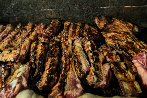 Argentinian grilled meat cooking - asado argentino - traditional argentinian food concept