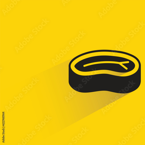 beef steak with shadow on yellow background