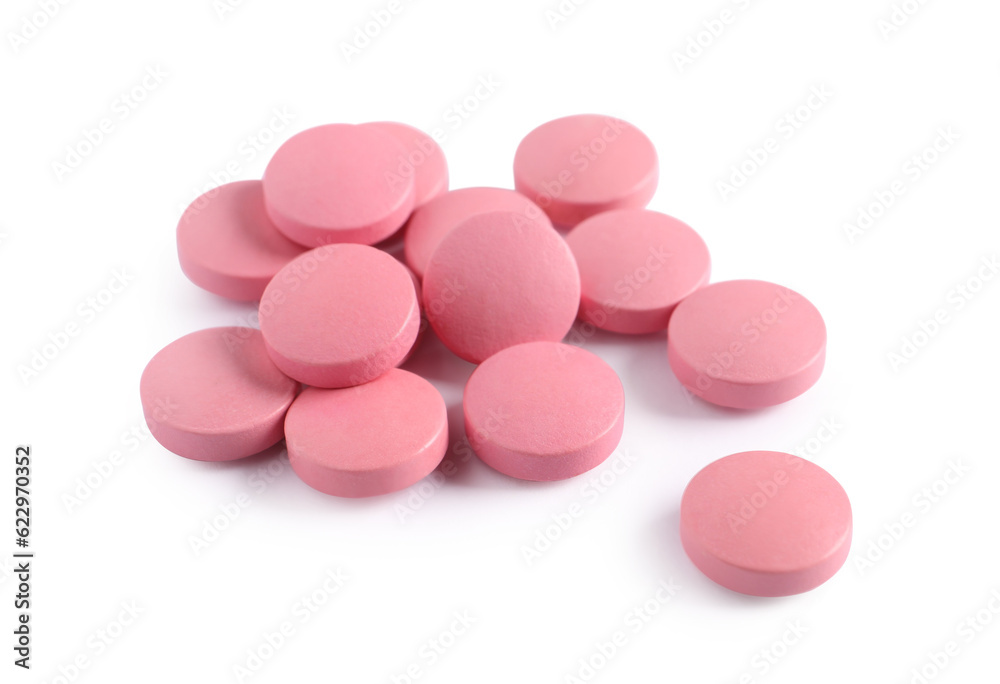 Pile of pink pills on white background Pile of pink pills on white background