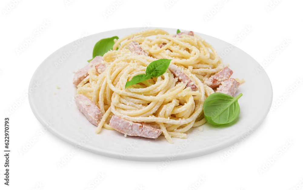 Plate of tasty pasta Carbonara with basil leaves isolated on white