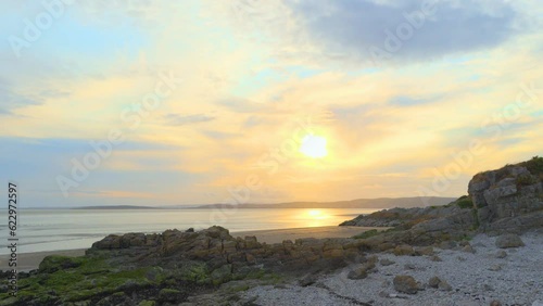 Time lapse fast moving clouds at sunset 30x normal speed using 1 second exposures at Silverdale Lancashire England UK photo