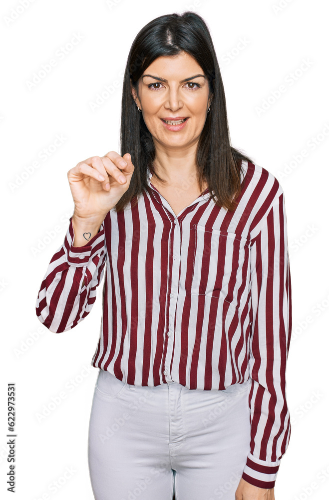 Beautiful brunette woman wearing striped shirt showing and pointing up with fingers number three while smiling confident and happy. Beautiful brunette woman wearing striped shirt showing and pointing up with fingers number three while smiling confident and happy.