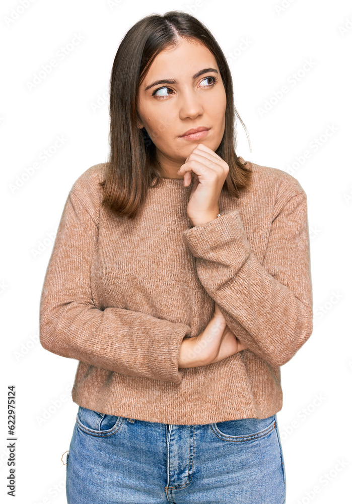 Young beautiful woman wearing casual clothes with hand on chin thinking about question, pensive expression. smiling with thoughtful face. doubt concept. Young beautiful woman wearing casual clothes with hand on chin thinking about question, pensive expression. smiling with thoughtful face. doubt concept.