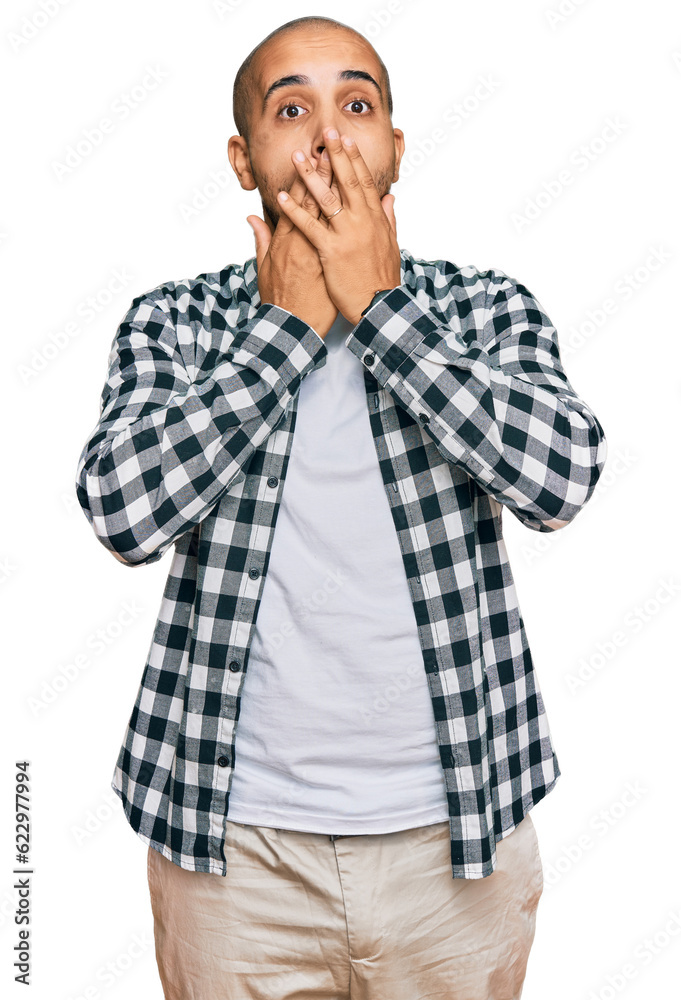 Hispanic adult man wearing casual clothes shocked covering mouth with hands for mistake. secret concept. Hispanic adult man wearing casual clothes shocked covering mouth with hands for mistake. secret concept.