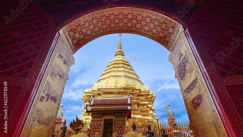 Wat Phra That Doi Suthep and beautiful patterned red door against the blue sky and white clouds. Famous Temple of Chiang Mai, Thailand. 4K Zoom in Shot.