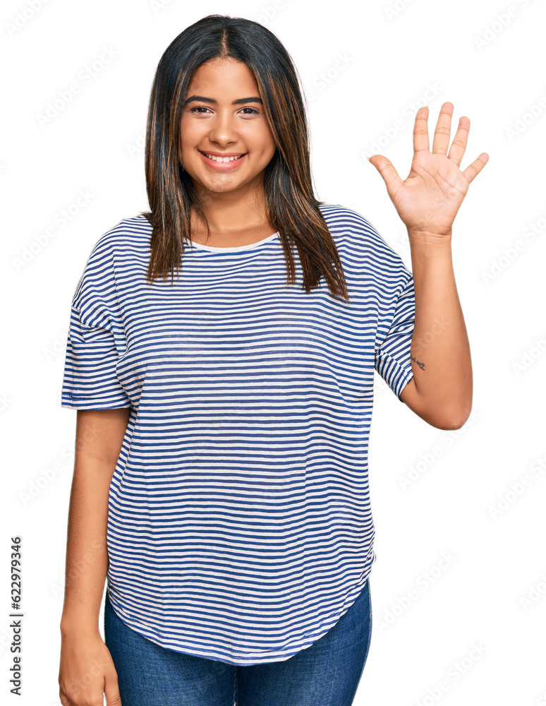 Young latin girl wearing casual clothes showing and pointing up with fingers number five while smiling confident and happy. Young latin girl wearing casual clothes showing and pointing up with fingers number five while smiling confident and happy.