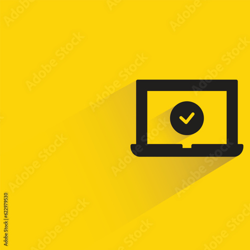 Free Download laptop and check mark with shadow on yellow background - GFXLoad