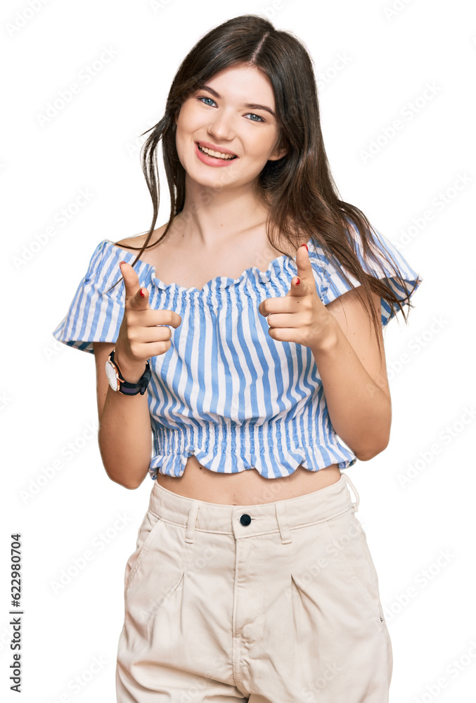 Young beautiful caucasian girl wearing casual clothes pointing fingers to camera with happy and funny face. good energy and vibes. Young beautiful caucasian girl wearing casual clothes pointing fingers to camera with happy and funny face. good energy and vibes.