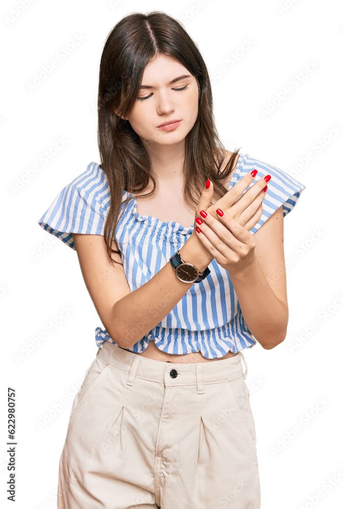 Young beautiful caucasian girl wearing casual clothes suffering pain on hands and fingers, arthritis inflammation Young beautiful caucasian girl wearing casual clothes suffering pain on hands and fingers, arthritis inflammation