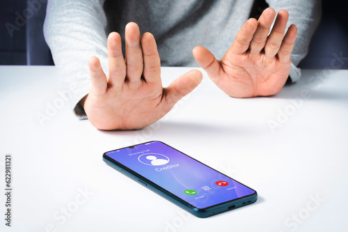 Debtor refusal to accept incoming call from creditor on smartphone. Financial or debt concept.