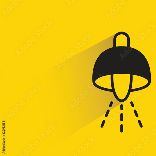 ceiling lamp with shadow on yellow background