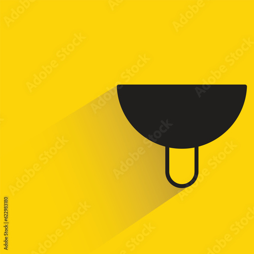 sink with shadow on yellow background