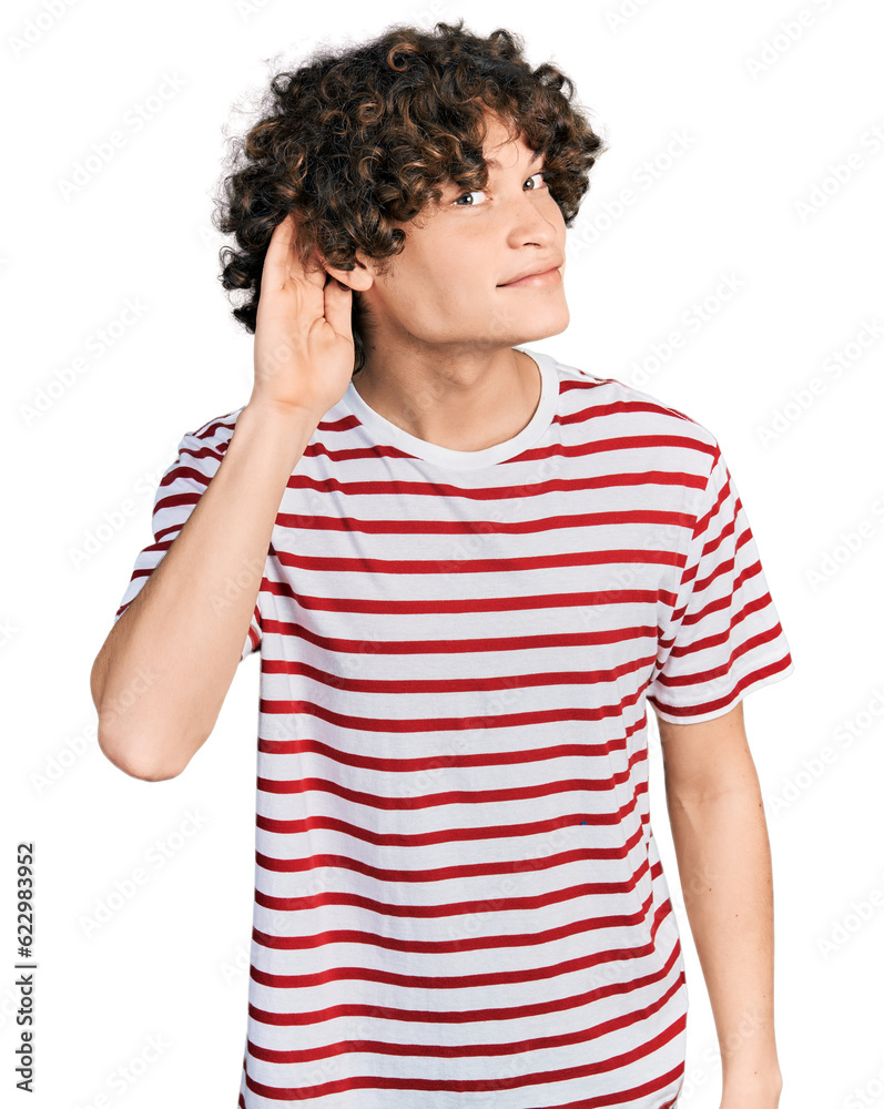 Caucasian teenager wearing casual clothes smiling with hand over ear listening an hearing to rumor or gossip. deafness concept. Caucasian teenager wearing casual clothes smiling with hand over ear listening an hearing to rumor or gossip. deafness concept.