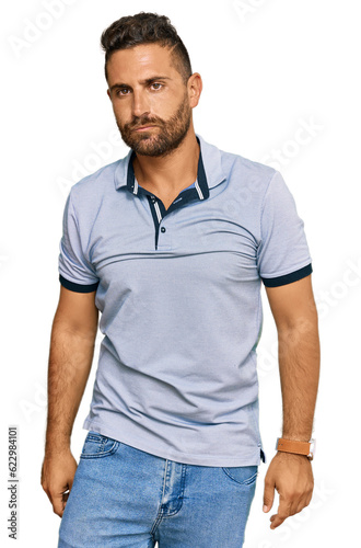 Handsome man with beard wearing casual clothes depressed and worry for distress, crying angry and afraid. sad expression.