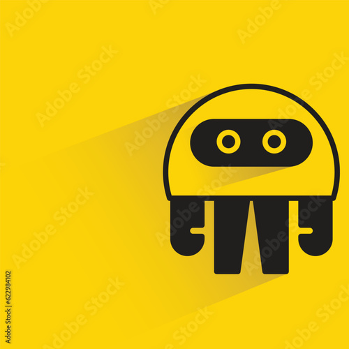 robot with shadow on yellow background