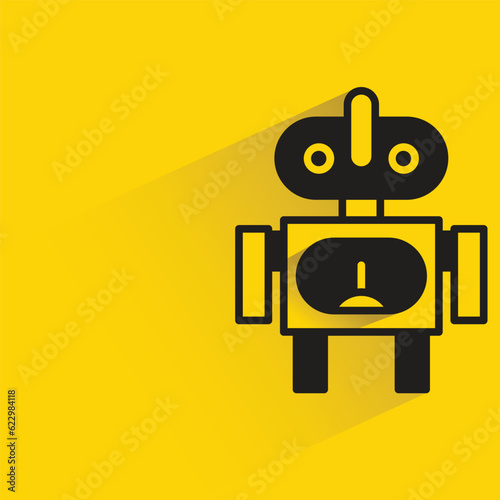 robot with shadow on yellow background