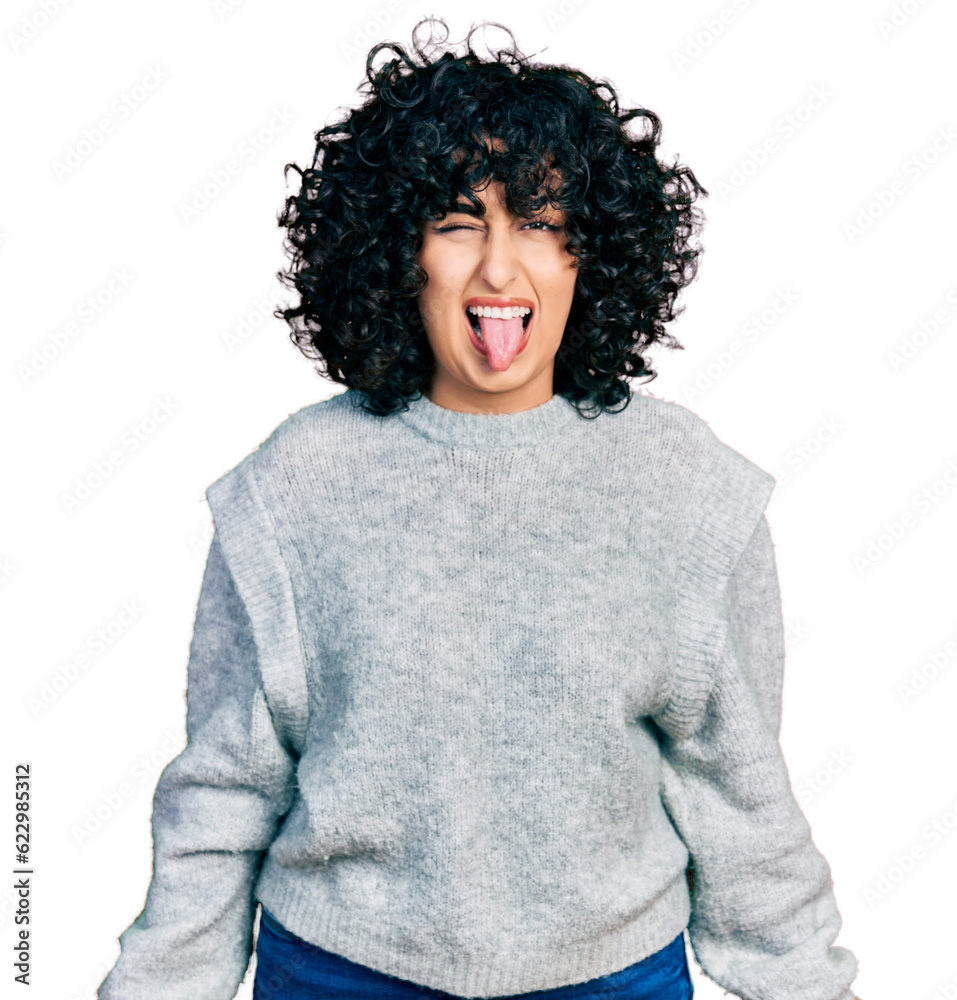 Young middle east girl wearing casual clothes winking looking at the camera with sexy expression, cheerful and happy face. Young middle east girl wearing casual clothes winking looking at the camera with sexy expression, cheerful and happy face.