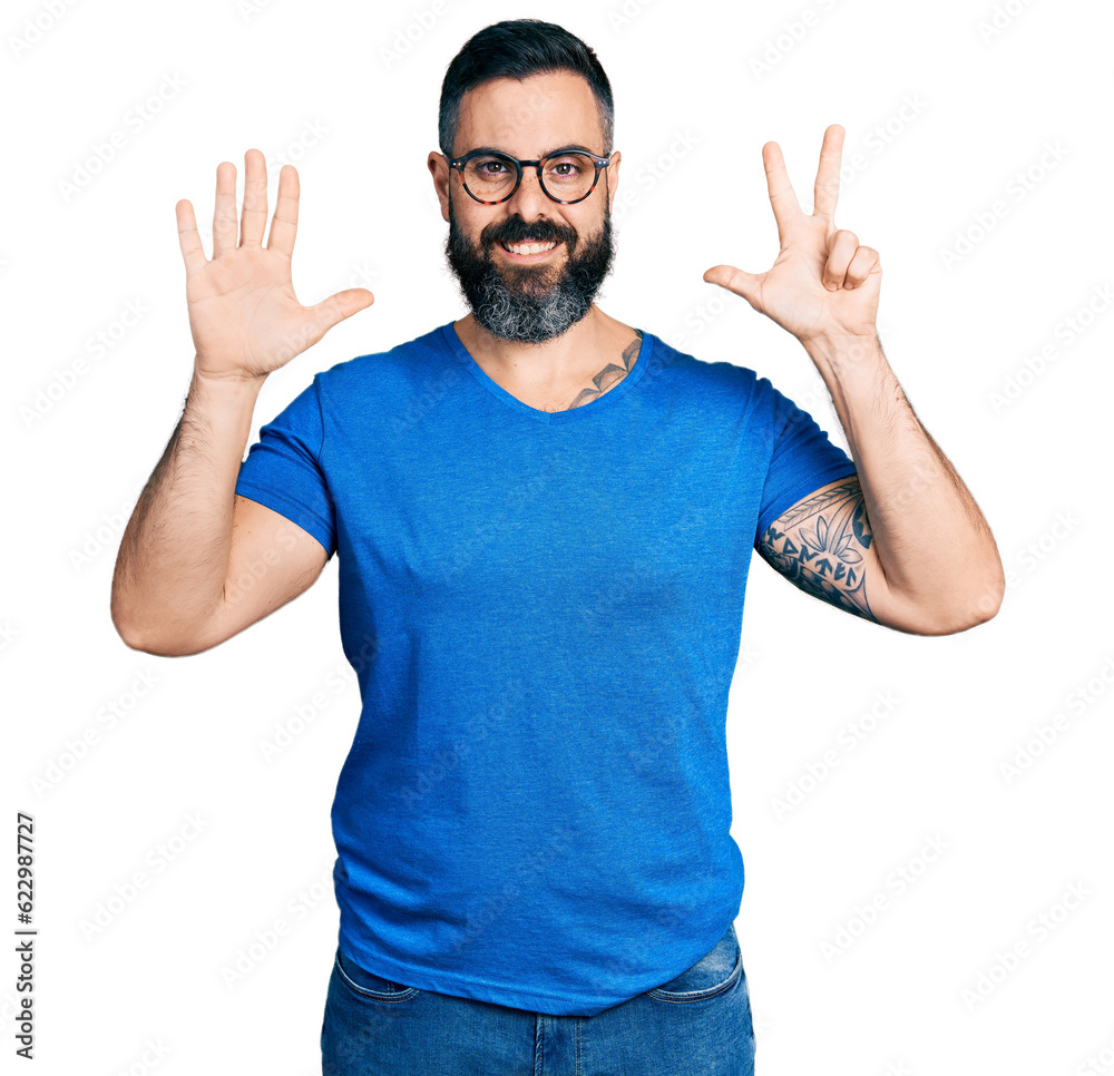 Hispanic man with beard wearing casual t shirt and glasses showing and pointing up with fingers number eight while smiling confident and happy. Hispanic man with beard wearing casual t shirt and glasses showing and pointing up with fingers number eight while smiling confident and happy.