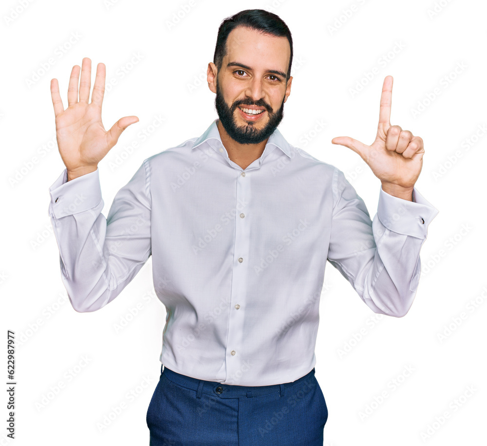Young man with beard wearing business shirt showing and pointing up with fingers number seven while smiling confident and happy. Young man with beard wearing business shirt showing and pointing up with fingers number seven while smiling confident and happy.